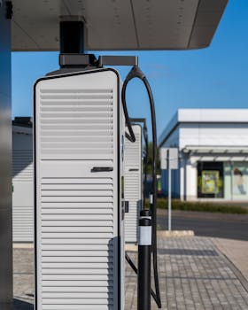 Electric vehicle charging station on a sunny day, showcasing sustainable urban technology.
