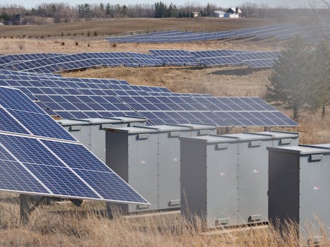 Expansive solar panel field in a rural area harnessing solar energy. Sustainable and renewable energy source.