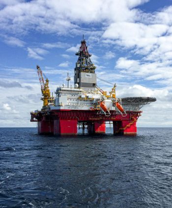 Majestic offshore oil platform under a bright sky in the North Sea, showcasing Norway's energy infrastructure.